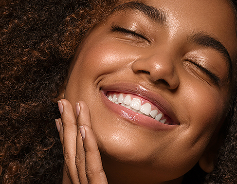 Woman using Melanated 82 products on skin